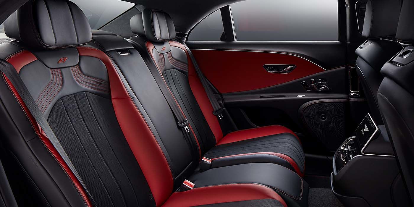 Bentley Milano Bentley Flying Spur S sedan rear interior in Beluga black and Hotspur red hide with S stitching