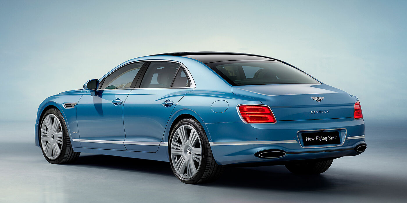 Bentley Milano New Bentley Flying Spur Azure sedan rear view in Light windsor blue by Mulliner paint with 22 inch Azure wheels and chrome exterior details
