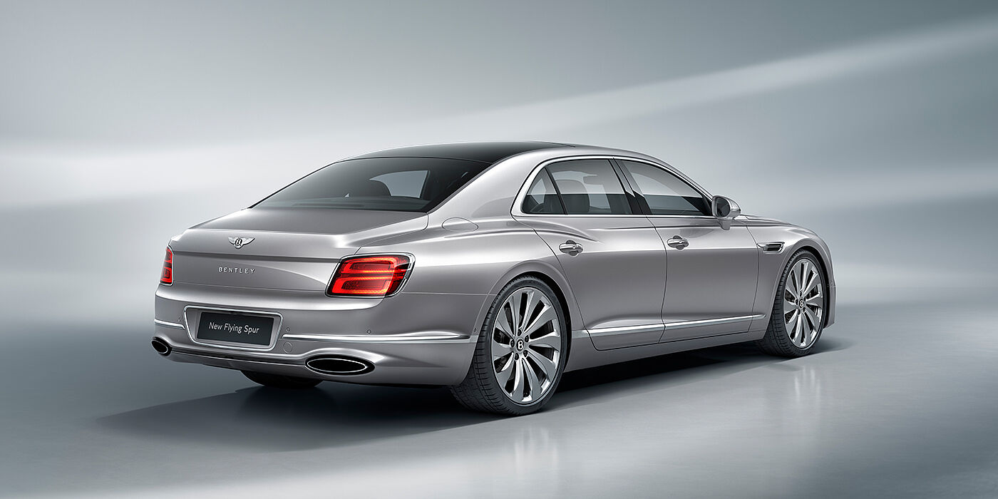 Bentley Milano New Bentley Flying Spur sedan rear view in Silverlake paint with ten spoke wheels and chrome matrix grille