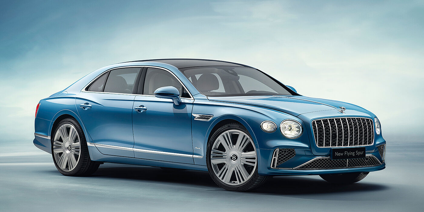 Bentley Milano New Bentley Flying Spur Azure sedan front view in Light windsor blue by Mulliner paint with 22 inch Azure wheels and chrome exterior details