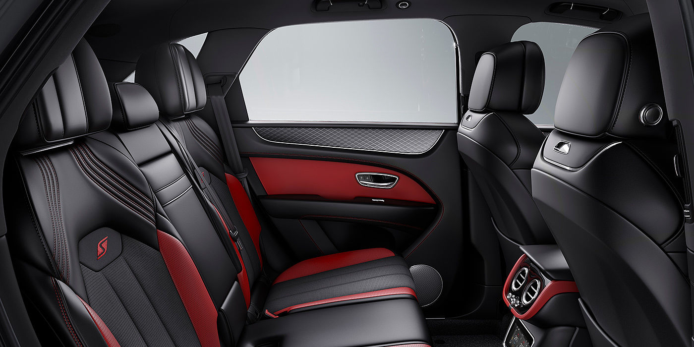 Bentley Milano Bentey Bentayga S interior view for rear passengers with Beluga black and Hotspur red coloured hide.