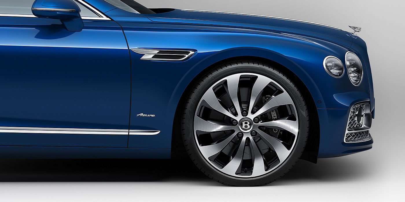 Bentley Milano Bentley Flying Spur Azure sedan side close up in Sequin Blue paint with Azure badge