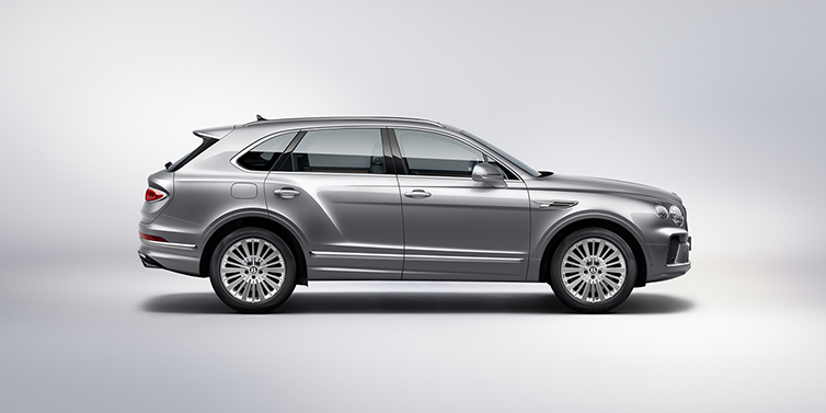 Bentley Milano Bentley Bentayga SUV side profile in Moonbeam silver paint against white background featuring 21 inch 5 spoke wheels